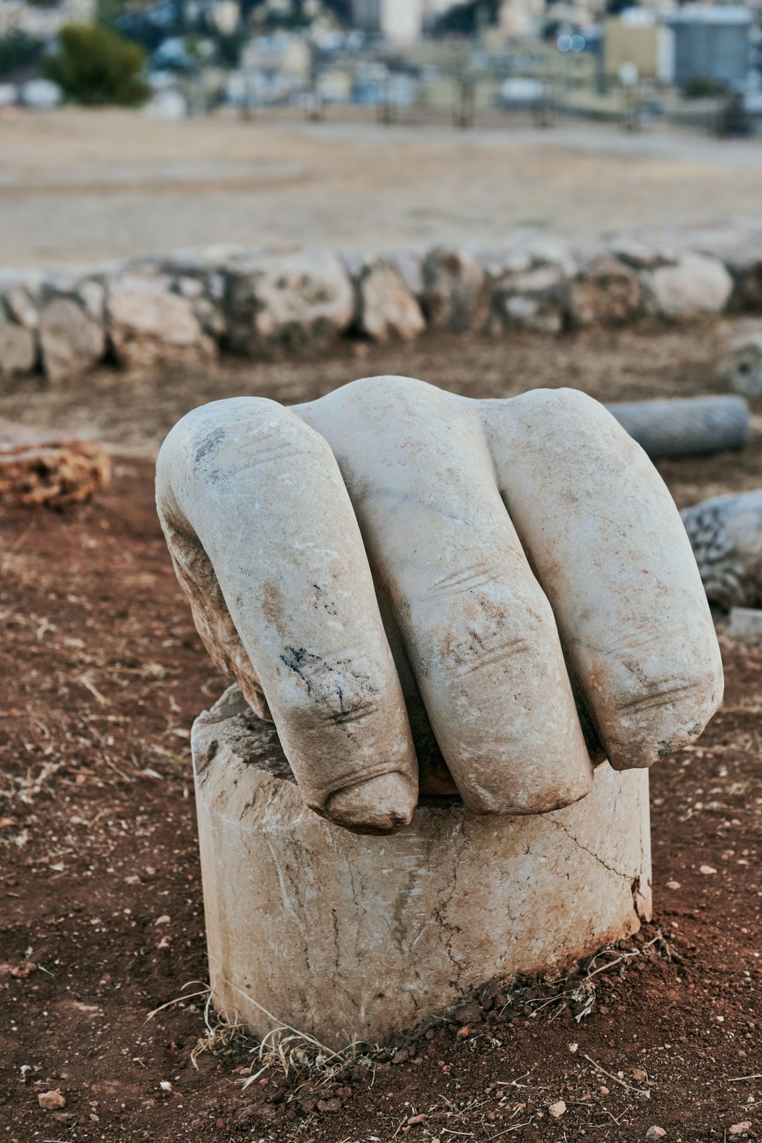 Giant carved stone hand on a pedestal