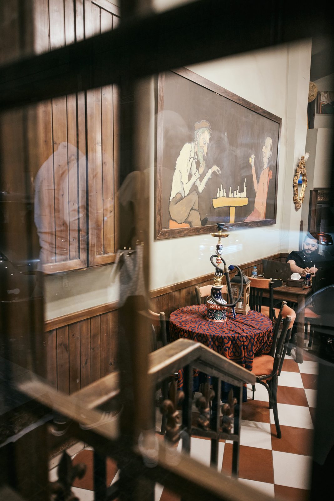 Old café seen through a window frame