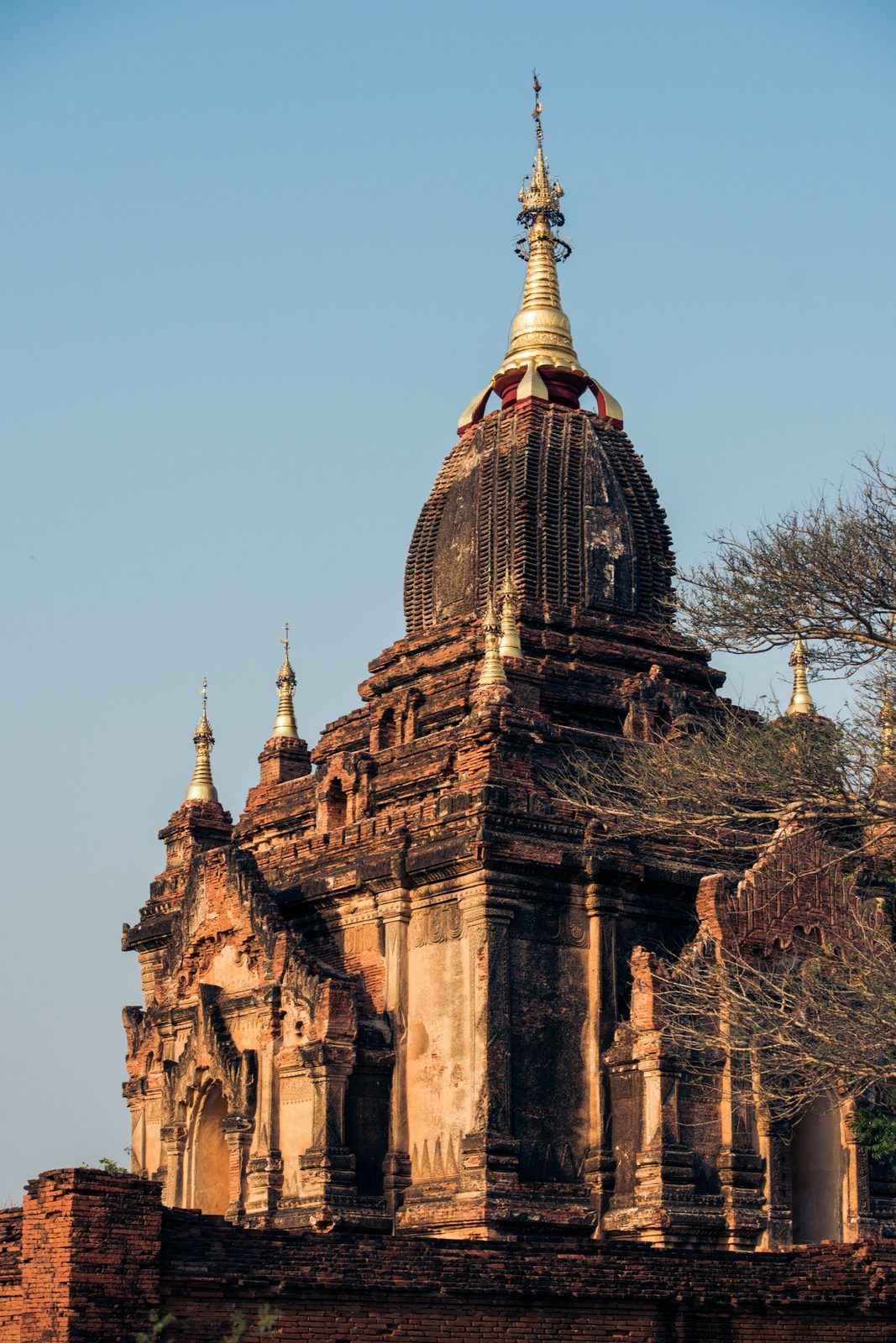 Gilded temple spire against a blue sky, Bagan, Myanmar