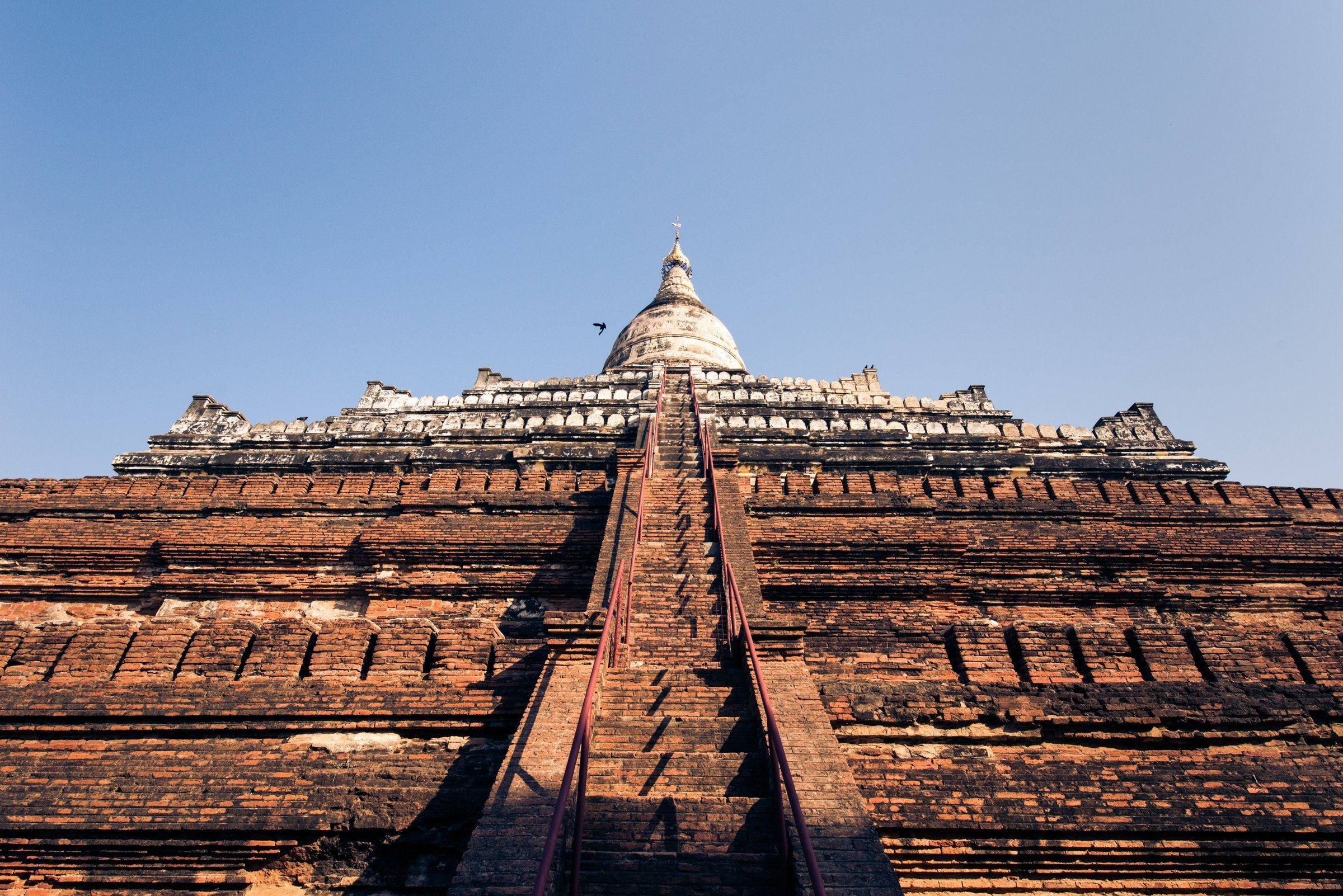 Looking up the stairway of a brick pagoda, Bagan, Myanmar