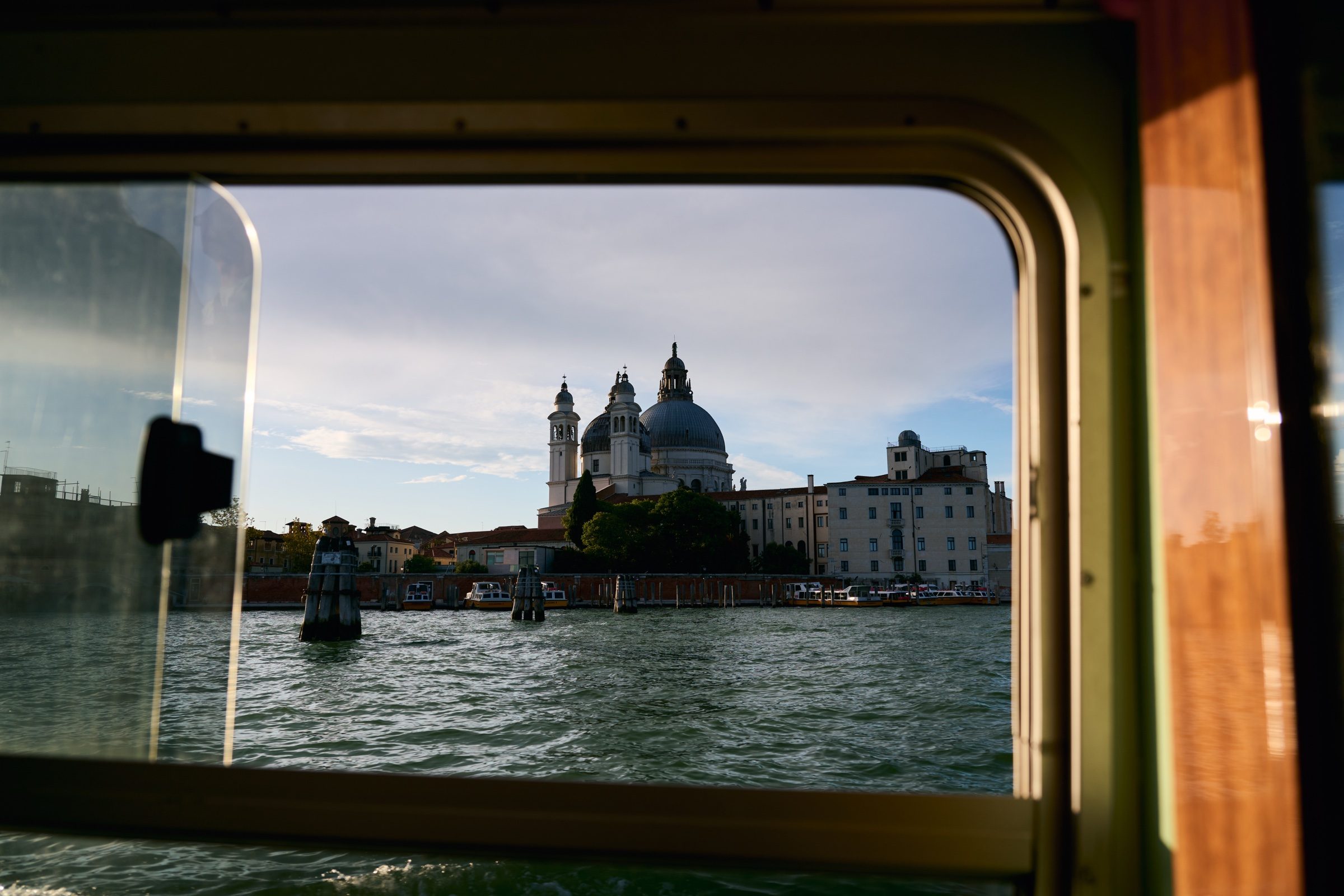Santa Maria della Salute framed by the window of a water bus, Venice