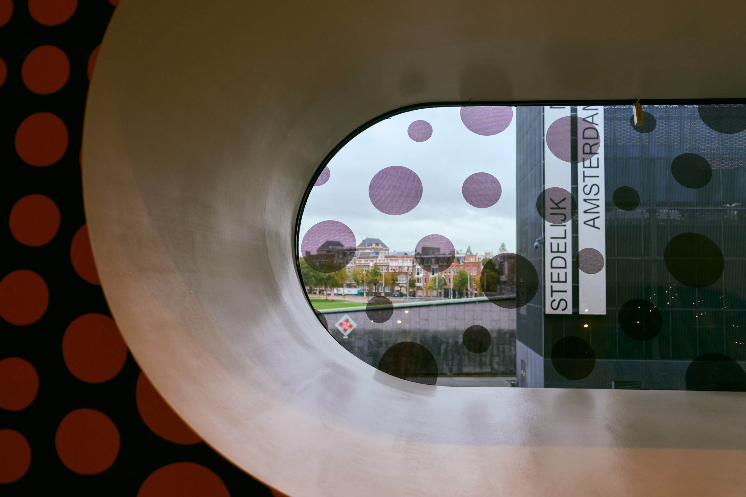 Window covered with dots looking out to Museumplein, Stedelijk Museum Amsterdam