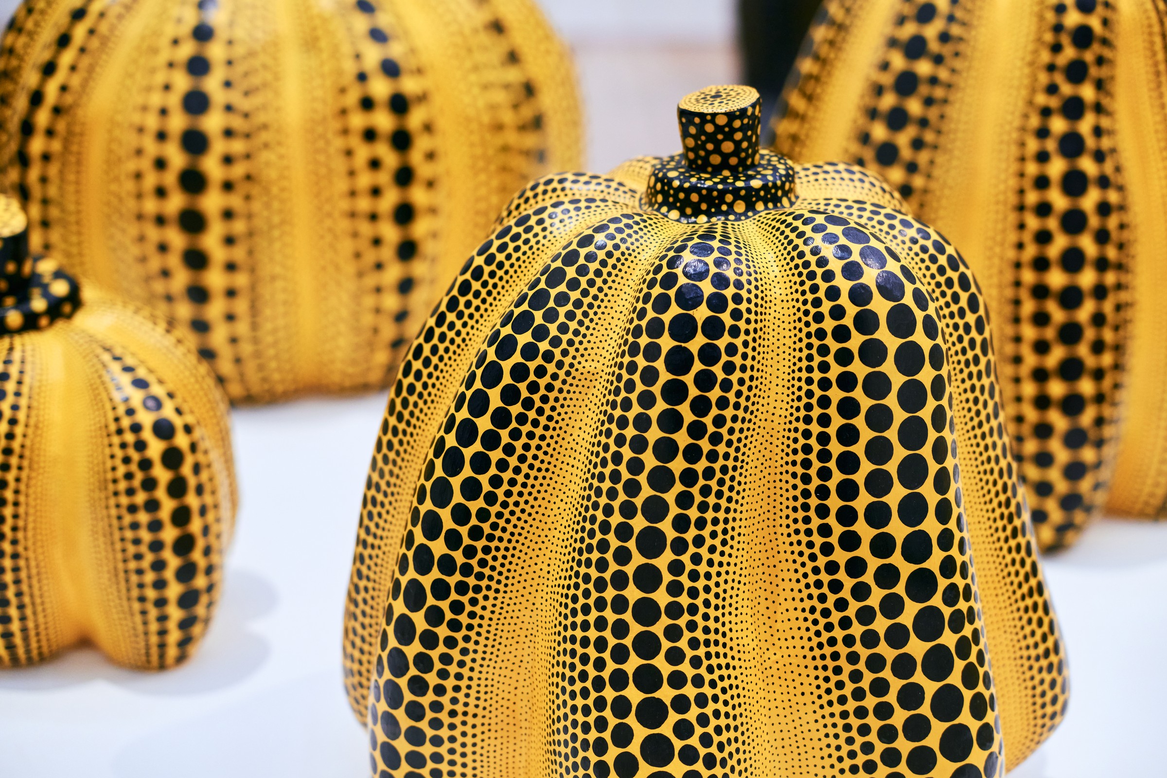 Group of yellow pumpkin sculptures with black dots, Yayoi Kusama, Stedelijk Museum Amsterdam