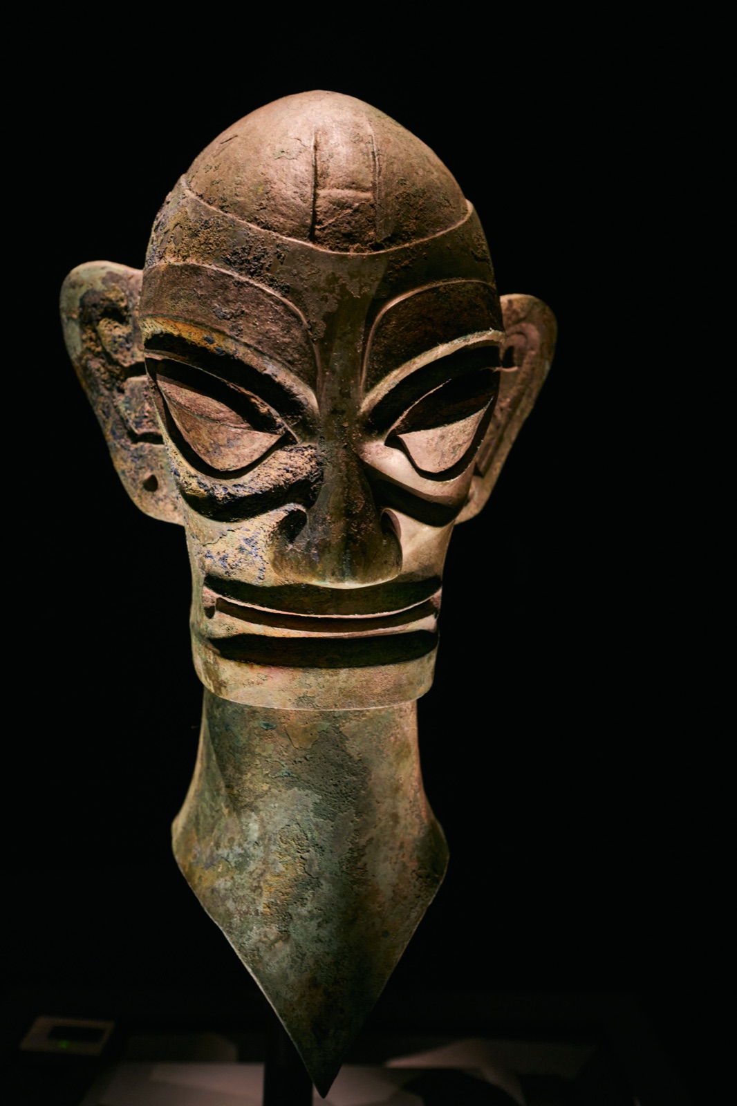 Bronze human head lit from above, Sanxingdui Museum, Guanghan, China