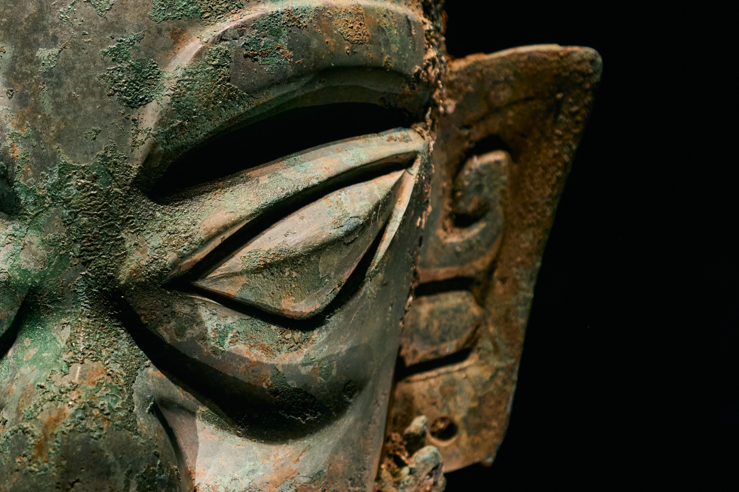Extreme close-up of a bronze mask's eye with patina, Sanxingdui Museum, Guanghan, China